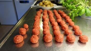 Homemade meatballs on the kitchen counter photo