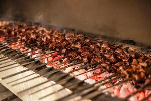 Grilled Meat Cooking on Outdoor Barbecue Grill photo