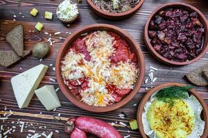 Table With Assorted Bowls Filled With Food photo