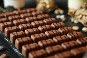 Close-Up of Varied Chocolates Arranged on Table photo