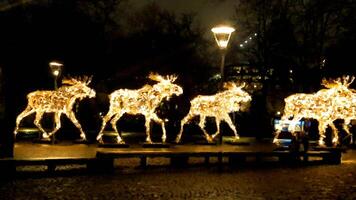 Luminous moose trotting at night on the street in Scandinavia in digital painting style photo