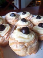 traditional Neapolitan sweets with custard and cherries photo