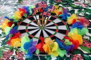 dartboard with a lgbt colored garland around it photo