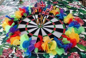 dartboard with a lgbt colored garland around it photo