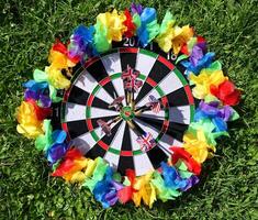 dartboard with a lgbt colored garland around it photo