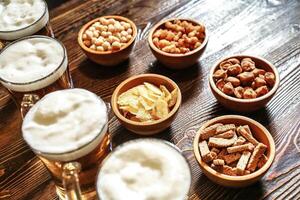 Wooden Table With Assorted Bowls of Food and Drinks photo