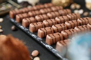 Assorted Chocolates and Nuts Covering a Table photo