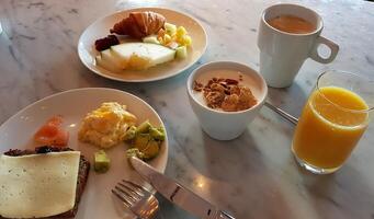 A rich and varied breakfast ready on the table photo