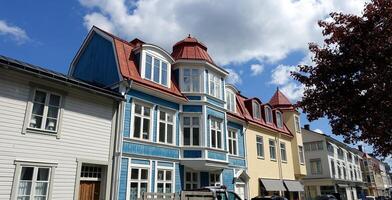 Colorful wooden buildings in the Stockholm region of Sweden. photo