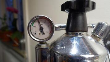 The pressure gauge of a coffee machine. photo