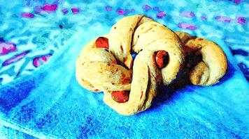 Tarallo, a donut-shaped salted biscuit with lard, pepper and almonds, typical of the southern regions of Italy. photo