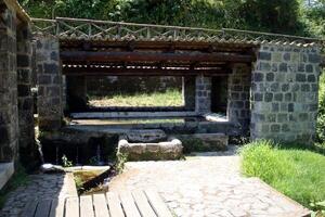 Santa Agata de Goti, Italy, Europe - July 21, 2019. the ancient Roman fountain immediately outside the center photo