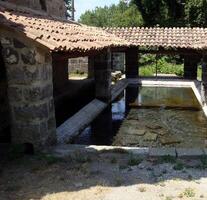 Santa Agata de Goti, Italy, Europe - July 21, 2019. the ancient Roman fountain immediately outside the center photo