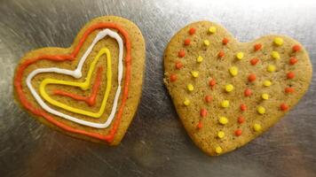 Ginger cookies decorated with colored hearts photo