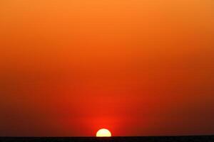 Lighting and color of the sky above the horizon at sunset. photo