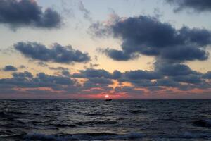 Lighting and color of the sky above the horizon at sunset. photo