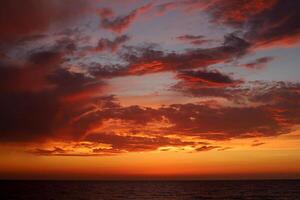 Lighting and color of the sky above the horizon at sunset. photo