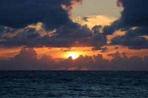 Lighting and color of the sky above the horizon at sunset. photo