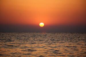 Lighting and color of the sky above the horizon at sunset. photo