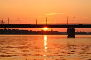 Lighting and color of the sky above the horizon at sunset. photo