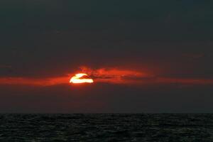 Lighting and color of the sky above the horizon at sunset. photo