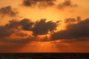Lighting and color of the sky above the horizon at sunset. photo