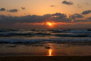 Lighting and color of the sky above the horizon at sunset. photo