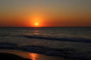 Lighting and color of the sky above the horizon at sunset. photo