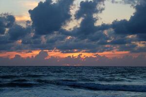 Lighting and color of the sky above the horizon at sunset. photo