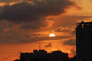 Lighting and color of the sky above the horizon at sunset. photo