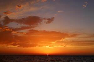 Lighting and color of the sky above the horizon at sunset. photo