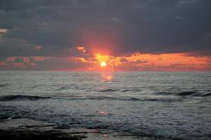 Lighting and color of the sky above the horizon at sunset. photo