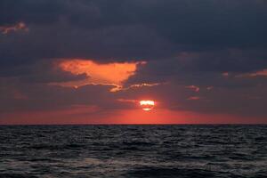 Lighting and color of the sky above the horizon at sunset. photo