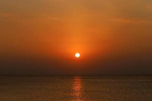 Lighting and color of the sky above the horizon at sunset. photo