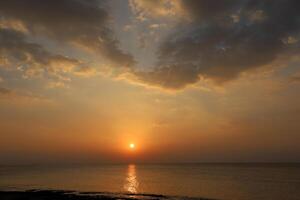 Lighting and color of the sky above the horizon at sunset. photo