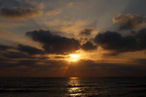 Lighting and color of the sky above the horizon at sunset. photo