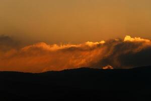 Lighting and color of the sky above the horizon at sunset. photo