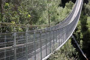 The bridge was built over a gorge and a water obstacle. photo