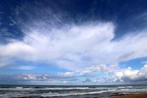 Rain clouds in the sky over the Mediterranean Sea. photo