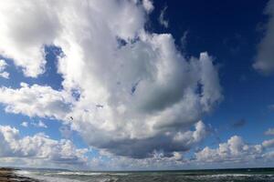 Rain clouds in the sky over the Mediterranean Sea. photo