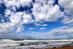 Rain clouds in the sky over the Mediterranean Sea. photo