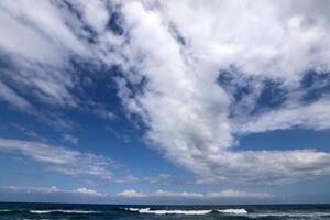 Rain clouds in the sky over the Mediterranean Sea. photo