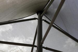 Canopy for protection from the hot sun in a city park. photo