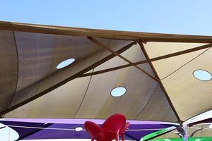 Canopy for protection from the hot sun in a city park. photo