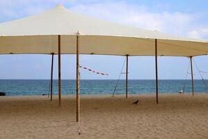 Canopy for protection from the hot sun in a city park. photo