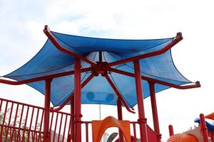 Canopy for protection from the hot sun in a city park. photo