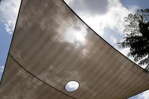 Canopy for protection from the hot sun in a city park. photo
