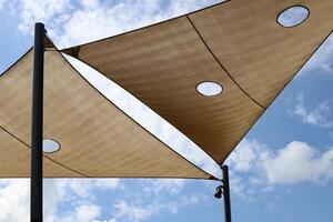 Canopy for protection from the hot sun in a city park. photo