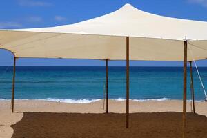 Canopy for protection from the hot sun in a city park. photo