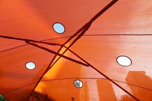 Canopy for protection from the hot sun in a city park. photo